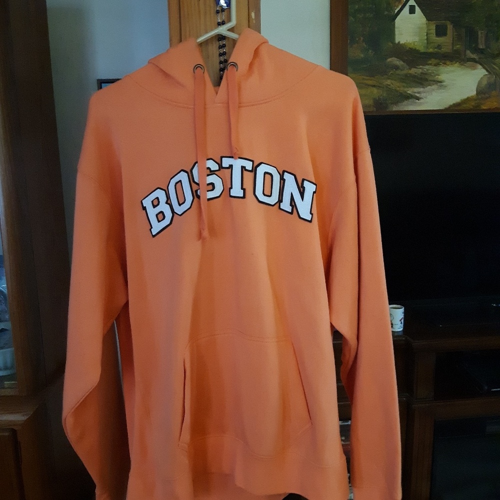 An orange pullover sweatshirt from Boston Mass